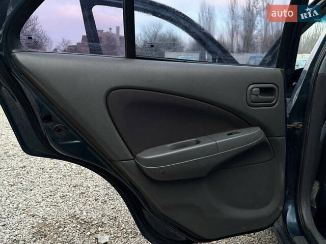 Синій Ніссан Альмера, об'ємом двигуна 1.6 л та пробігом 191 тис. км за 4100 $, фото 15 на Automoto.ua