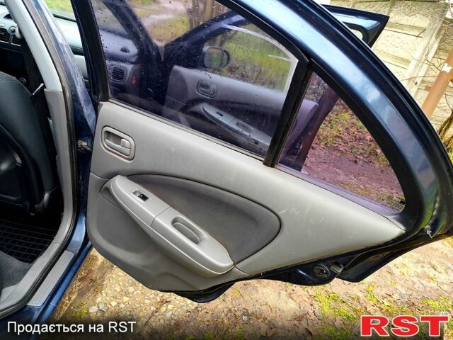 Синий Ниссан Альмера, объемом двигателя 1.6 л и пробегом 191 тыс. км за 4800 $, фото 6 на Automoto.ua