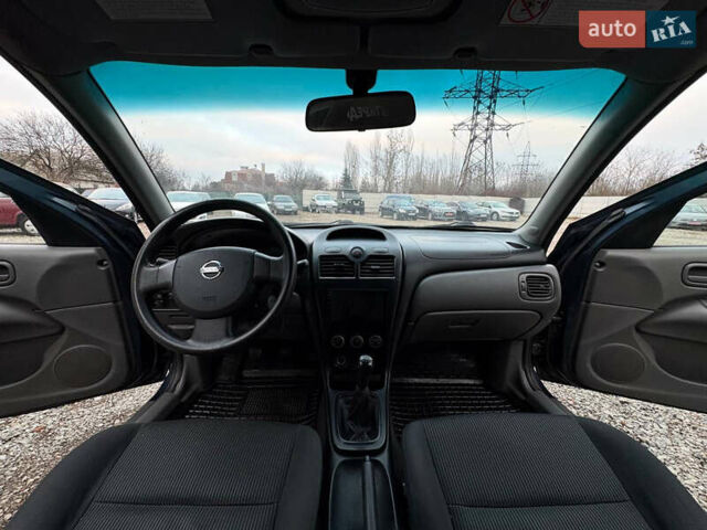 Синій Ніссан Альмера, об'ємом двигуна 1.6 л та пробігом 191 тис. км за 4100 $, фото 13 на Automoto.ua