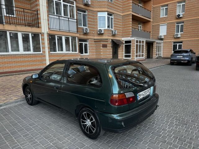 Зелений Ніссан Альмера, об'ємом двигуна 1.4 л та пробігом 227 тис. км за 2000 $, фото 3 на Automoto.ua