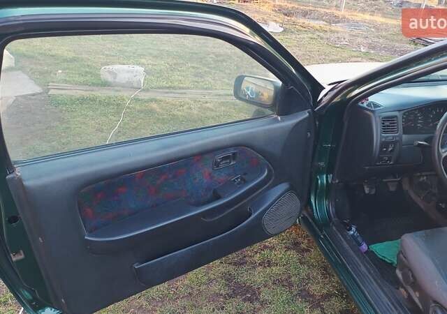 Зеленый Ниссан Альмера, объемом двигателя 1.4 л и пробегом 375 тыс. км за 1300 $, фото 3 на Automoto.ua