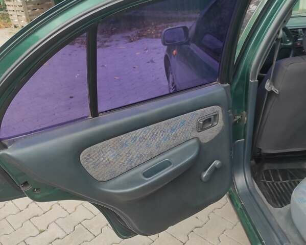 Зеленый Ниссан Альмера, объемом двигателя 1.4 л и пробегом 240 тыс. км за 1350 $, фото 11 на Automoto.ua
