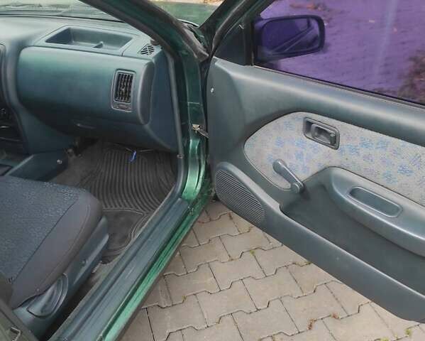 Зеленый Ниссан Альмера, объемом двигателя 1.4 л и пробегом 240 тыс. км за 1350 $, фото 7 на Automoto.ua