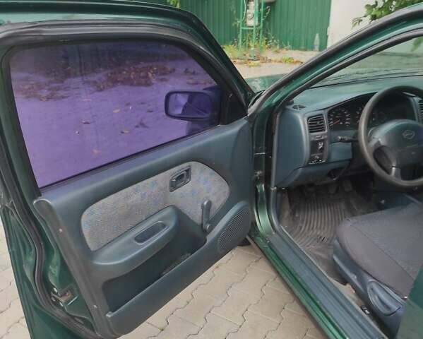 Зеленый Ниссан Альмера, объемом двигателя 1.4 л и пробегом 240 тыс. км за 1350 $, фото 5 на Automoto.ua