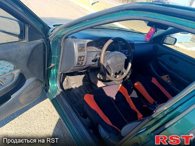 Зелений Ніссан Альмера, об'ємом двигуна 1.4 л та пробігом 400 тис. км за 2200 $, фото 5 на Automoto.ua