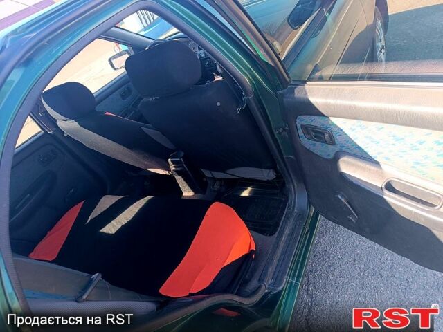 Зелений Ніссан Альмера, об'ємом двигуна 1.4 л та пробігом 400 тис. км за 2200 $, фото 4 на Automoto.ua