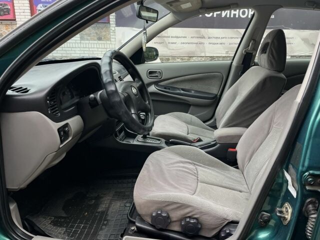 Зеленый Ниссан Альмера, объемом двигателя 1.8 л и пробегом 245 тыс. км за 3999 $, фото 12 на Automoto.ua