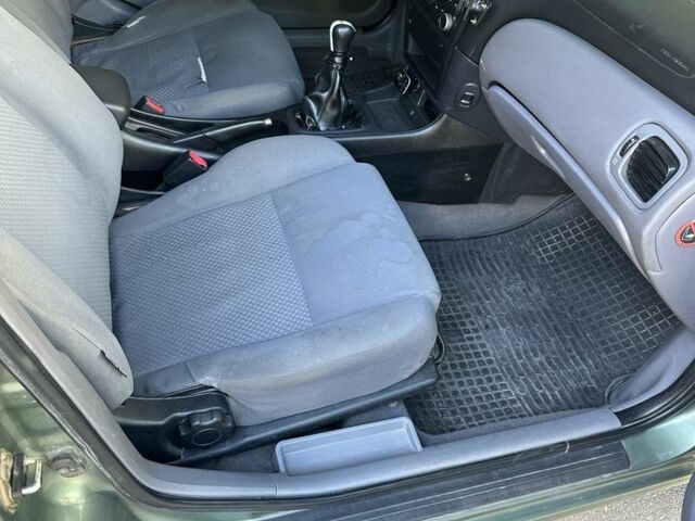 Зеленый Ниссан Альмера, объемом двигателя 1.5 л и пробегом 369 тыс. км за 3500 $, фото 7 на Automoto.ua