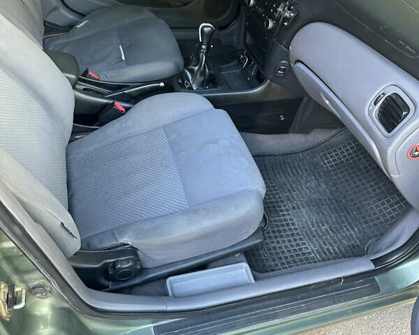 Зеленый Ниссан Альмера, объемом двигателя 1.46 л и пробегом 369 тыс. км за 3000 $, фото 7 на Automoto.ua