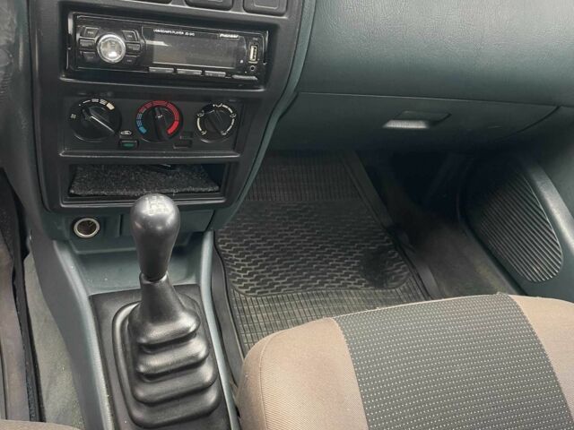 Зеленый Ниссан Альмера, объемом двигателя 1.4 л и пробегом 234 тыс. км за 1900 $, фото 11 на Automoto.ua