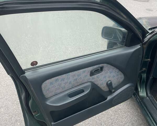 Зеленый Ниссан Альмера, объемом двигателя 1.39 л и пробегом 234 тыс. км за 1900 $, фото 8 на Automoto.ua