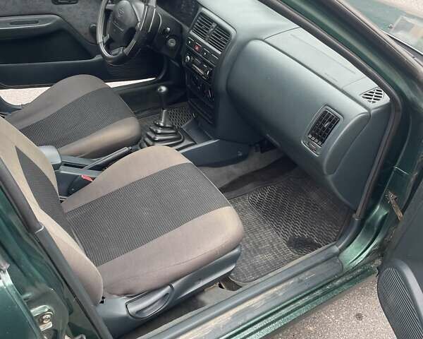 Зеленый Ниссан Альмера, объемом двигателя 1.39 л и пробегом 234 тыс. км за 1900 $, фото 15 на Automoto.ua