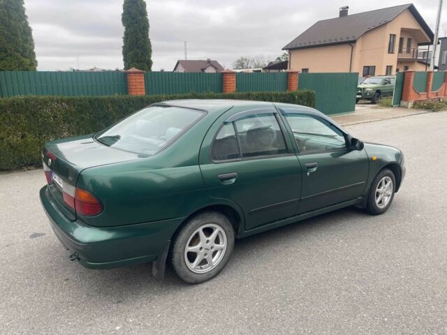 Зеленый Ниссан Альмера, объемом двигателя 1.4 л и пробегом 234 тыс. км за 1900 $, фото 5 на Automoto.ua