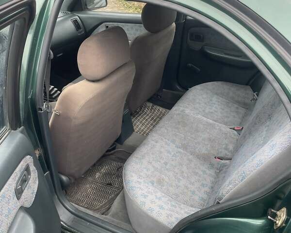 Зеленый Ниссан Альмера, объемом двигателя 1.39 л и пробегом 234 тыс. км за 1900 $, фото 13 на Automoto.ua