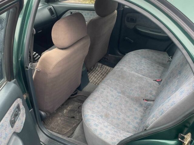 Зеленый Ниссан Альмера, объемом двигателя 1.4 л и пробегом 234 тыс. км за 1900 $, фото 13 на Automoto.ua