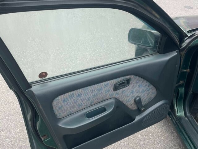 Зеленый Ниссан Альмера, объемом двигателя 1.4 л и пробегом 234 тыс. км за 1900 $, фото 8 на Automoto.ua