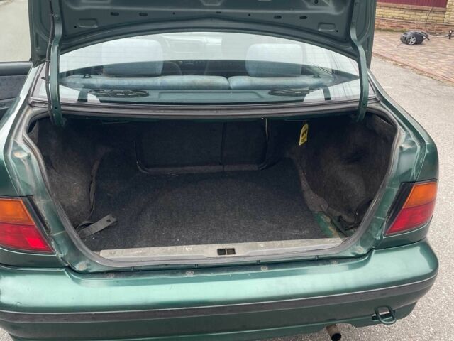 Зеленый Ниссан Альмера, объемом двигателя 1.4 л и пробегом 234 тыс. км за 1900 $, фото 14 на Automoto.ua