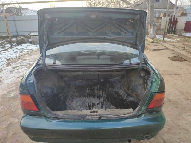 Зелений Ніссан Альмера, об'ємом двигуна 1.4 л та пробігом 100 тис. км за 1000 $, фото 6 на Automoto.ua