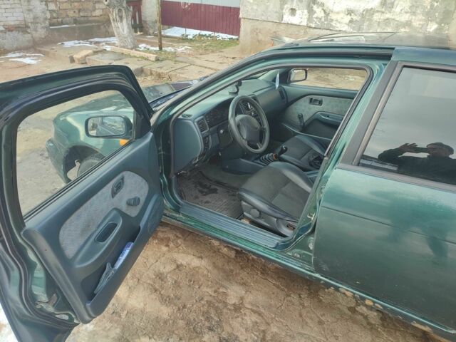 Зелений Ніссан Альмера, об'ємом двигуна 1.4 л та пробігом 100 тис. км за 1000 $, фото 8 на Automoto.ua