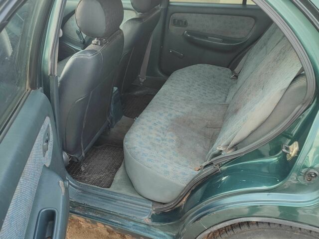 Зелений Ніссан Альмера, об'ємом двигуна 1.4 л та пробігом 100 тис. км за 1000 $, фото 7 на Automoto.ua