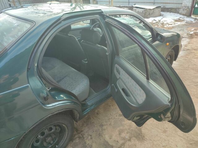 Зелений Ніссан Альмера, об'ємом двигуна 1.4 л та пробігом 100 тис. км за 1000 $, фото 5 на Automoto.ua