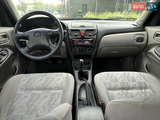 Зелений Ніссан Альмера, об'ємом двигуна 1.5 л та пробігом 276 тис. км за 3700 $, фото 6 на Automoto.ua