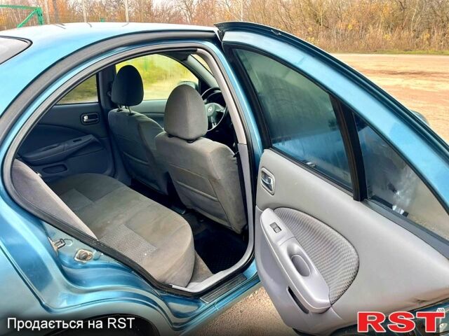 Зелений Ніссан Альмера, об'ємом двигуна 1.8 л та пробігом 217 тис. км за 2800 $, фото 12 на Automoto.ua