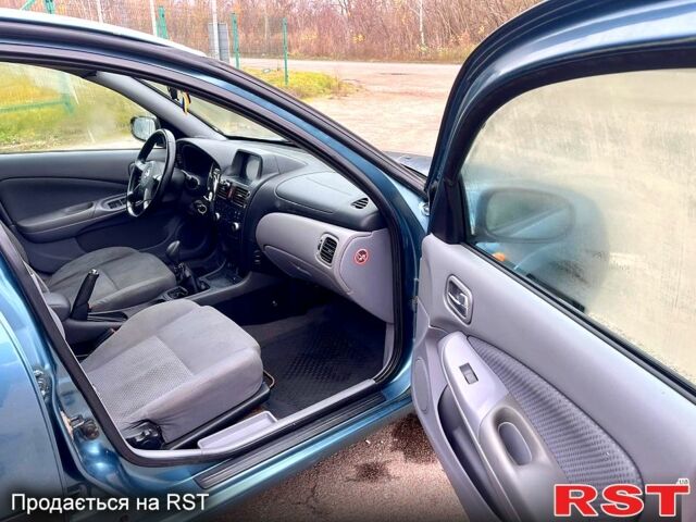 Зелений Ніссан Альмера, об'ємом двигуна 1.8 л та пробігом 217 тис. км за 2800 $, фото 11 на Automoto.ua