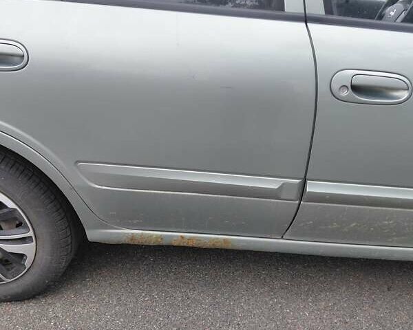 Зеленый Ниссан Альмера, объемом двигателя 1.6 л и пробегом 233 тыс. км за 3700 $, фото 3 на Automoto.ua