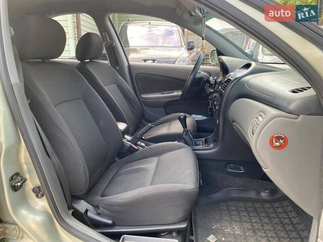 Зелений Ніссан Альмера, об'ємом двигуна 1.6 л та пробігом 75 тис. км за 5990 $, фото 11 на Automoto.ua