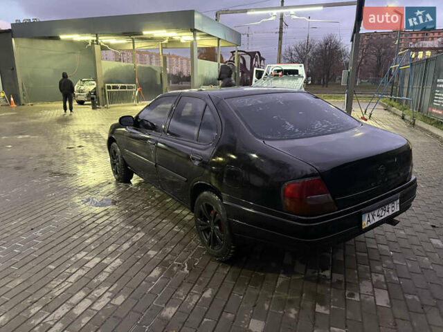 Черный Ниссан Альтима, объемом двигателя 2.4 л и пробегом 197 тыс. км за 3000 $, фото 1 на Automoto.ua