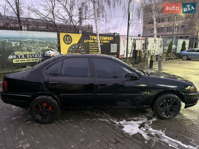 Черный Ниссан Альтима, объемом двигателя 2.4 л и пробегом 197 тыс. км за 3000 $, фото 3 на Automoto.ua