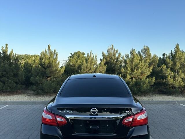 Черный Ниссан Альтима, объемом двигателя 2.5 л и пробегом 163 тыс. км за 9100 $, фото 2 на Automoto.ua