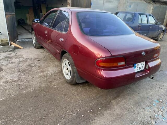 Красный Ниссан Альтима, объемом двигателя 2.4 л и пробегом 200 тыс. км за 1850 $, фото 3 на Automoto.ua