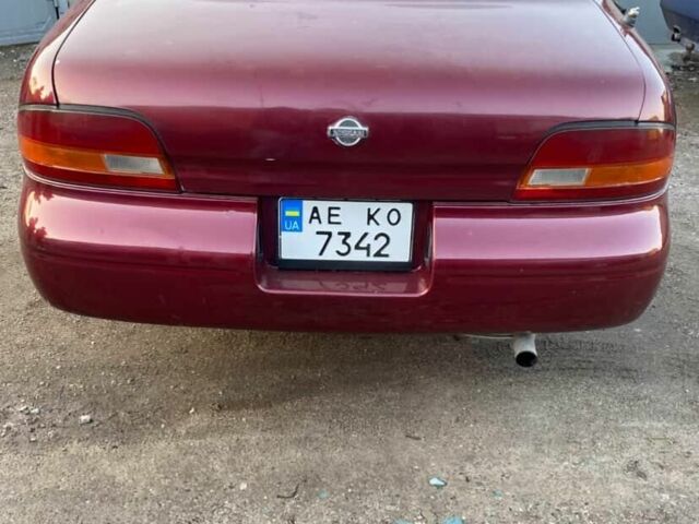 Красный Ниссан Альтима, объемом двигателя 2.4 л и пробегом 200 тыс. км за 1850 $, фото 2 на Automoto.ua