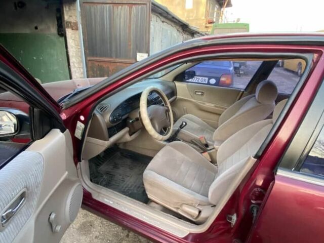 Красный Ниссан Альтима, объемом двигателя 2.4 л и пробегом 200 тыс. км за 1850 $, фото 4 на Automoto.ua