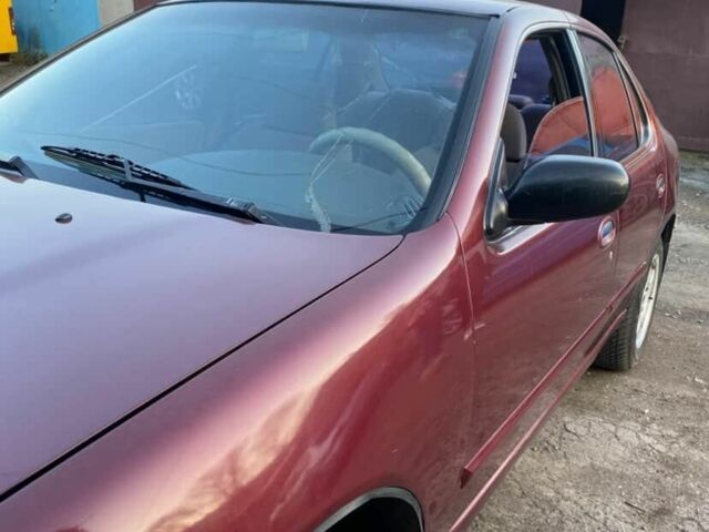 Красный Ниссан Альтима, объемом двигателя 2.4 л и пробегом 200 тыс. км за 1850 $, фото 1 на Automoto.ua