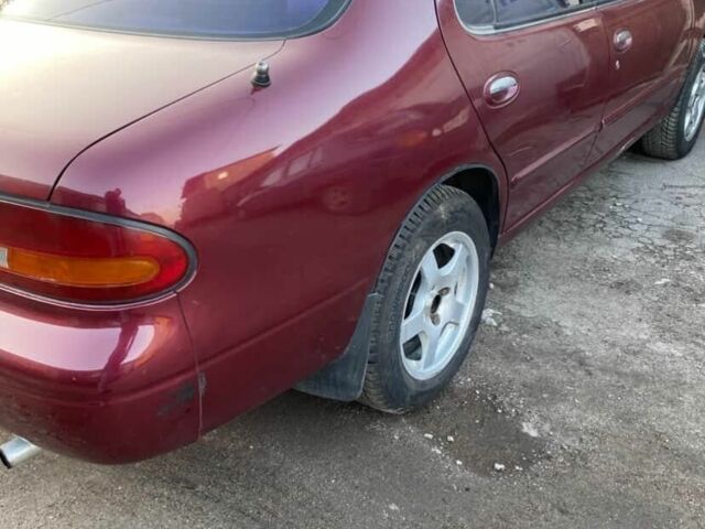 Красный Ниссан Альтима, объемом двигателя 2.4 л и пробегом 200 тыс. км за 1850 $, фото 10 на Automoto.ua