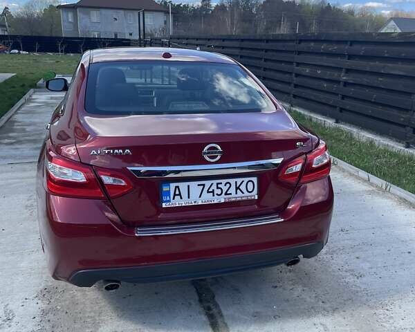 Красный Ниссан Альтима, объемом двигателя 2.49 л и пробегом 162 тыс. км за 11000 $, фото 6 на Automoto.ua