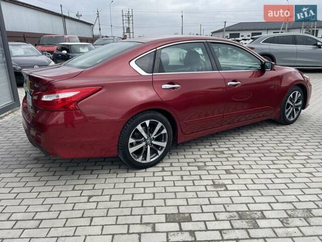 Красный Ниссан Альтима, объемом двигателя 2.49 л и пробегом 170 тыс. км за 8800 $, фото 5 на Automoto.ua