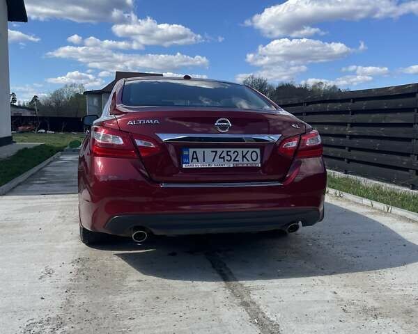 Красный Ниссан Альтима, объемом двигателя 2.49 л и пробегом 162 тыс. км за 11000 $, фото 4 на Automoto.ua