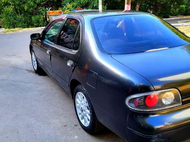 Серый Ниссан Альтима, объемом двигателя 2.4 л и пробегом 240 тыс. км за 1500 $, фото 2 на Automoto.ua