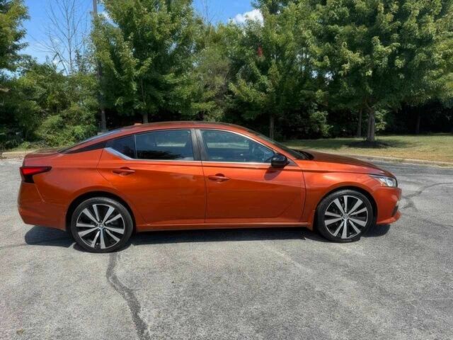 Помаранчевий Ніссан Альтіма, об'ємом двигуна 2.5 л та пробігом 40 тис. км за 8000 $, фото 7 на Automoto.ua