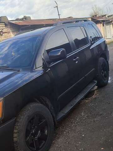 Черный Ниссан Армада, объемом двигателя 5.6 л и пробегом 300 тыс. км за 8500 $, фото 1 на Automoto.ua