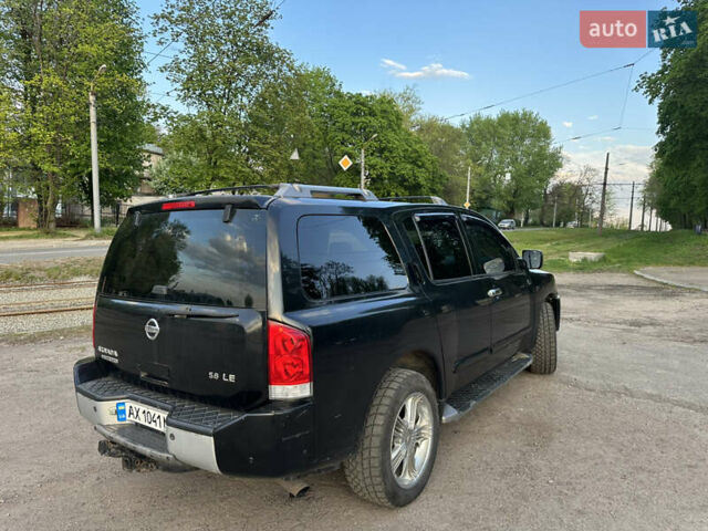 Черный Ниссан Армада, объемом двигателя 5.6 л и пробегом 322 тыс. км за 8000 $, фото 3 на Automoto.ua