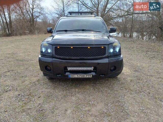 Черный Ниссан Армада, объемом двигателя 5.6 л и пробегом 255 тыс. км за 8000 $, фото 1 на Automoto.ua