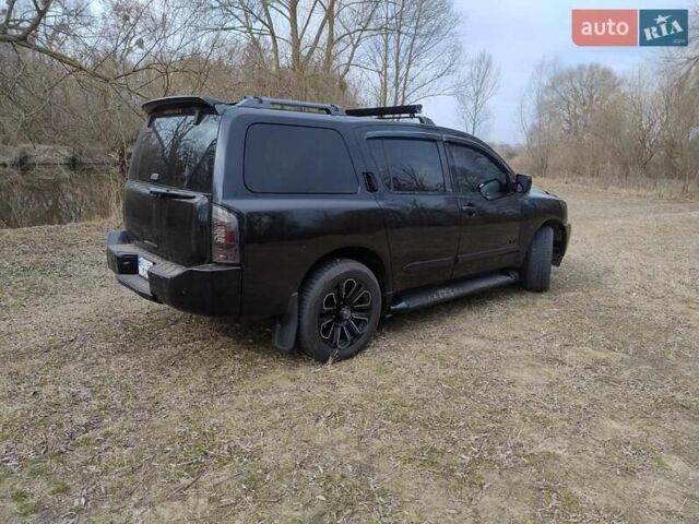 Черный Ниссан Армада, объемом двигателя 5.6 л и пробегом 255 тыс. км за 8000 $, фото 4 на Automoto.ua