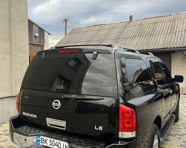 Черный Ниссан Армада, объемом двигателя 5.6 л и пробегом 244 тыс. км за 10999 $, фото 4 на Automoto.ua