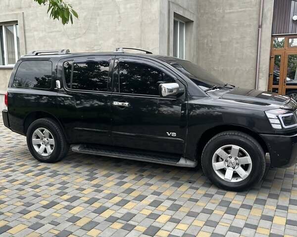 Черный Ниссан Армада, объемом двигателя 5.6 л и пробегом 255 тыс. км за 9000 $, фото 6 на Automoto.ua