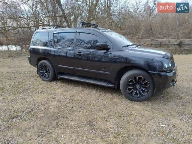 Черный Ниссан Армада, объемом двигателя 5.6 л и пробегом 255 тыс. км за 8000 $, фото 3 на Automoto.ua